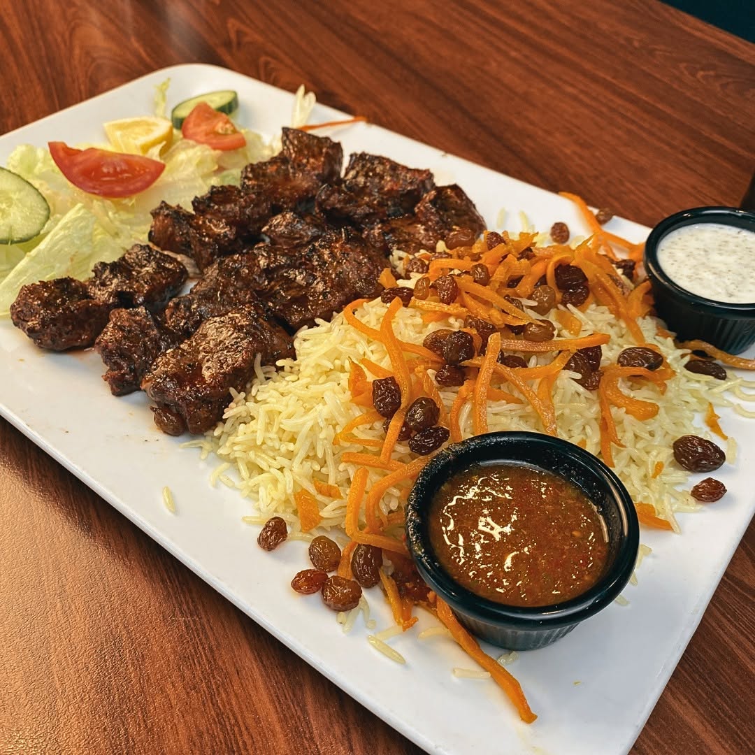 Charcoal-grilled lamb served with fragrant rice and fresh salad at Afghan Cuisine Blair Athol